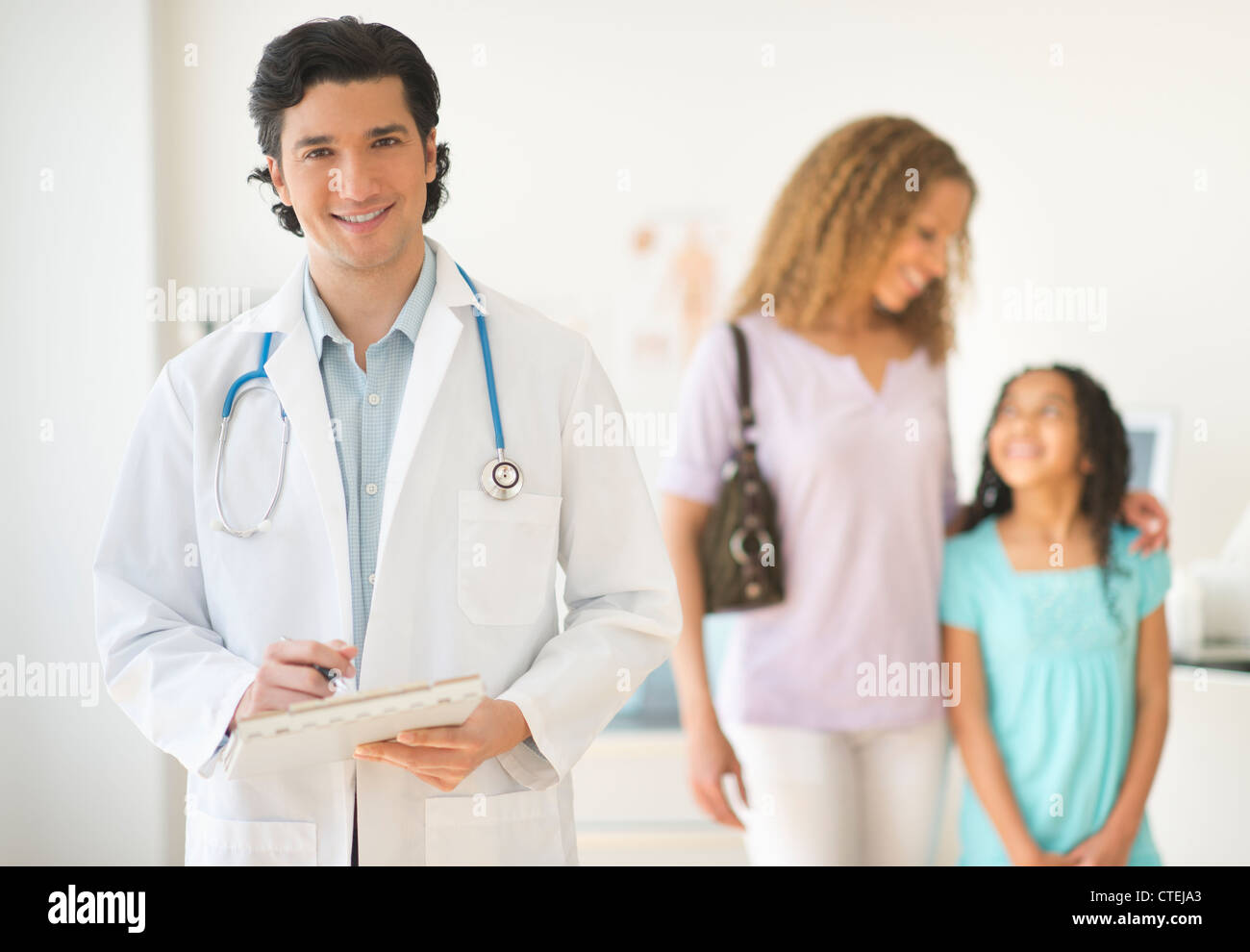 USA, New Jersey, Jersey City, Doctor with patients (woman and girl aged