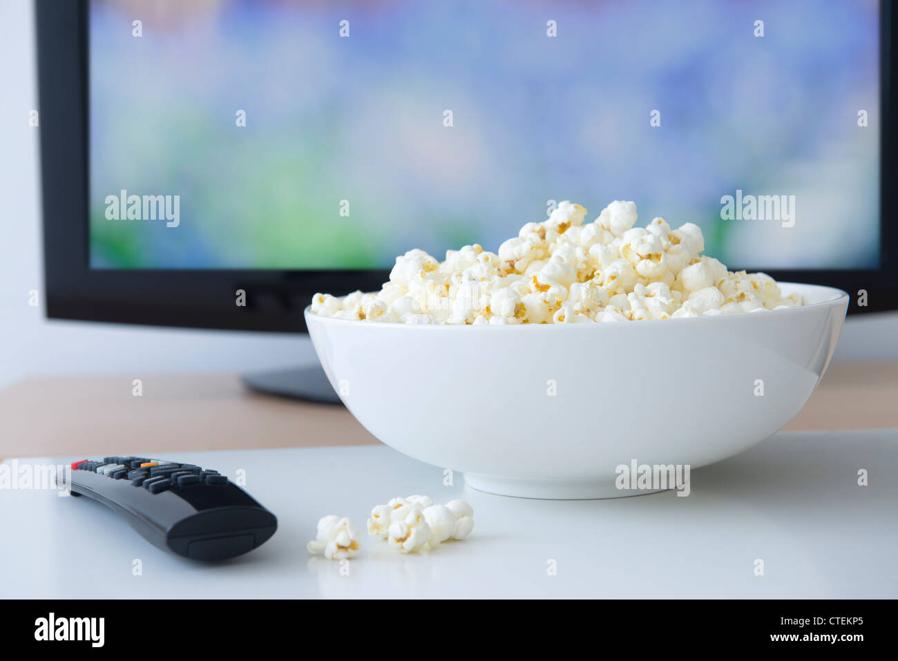 USA, New Jersey, Jersey City, Television set and bowl of popcorn Stock Photo