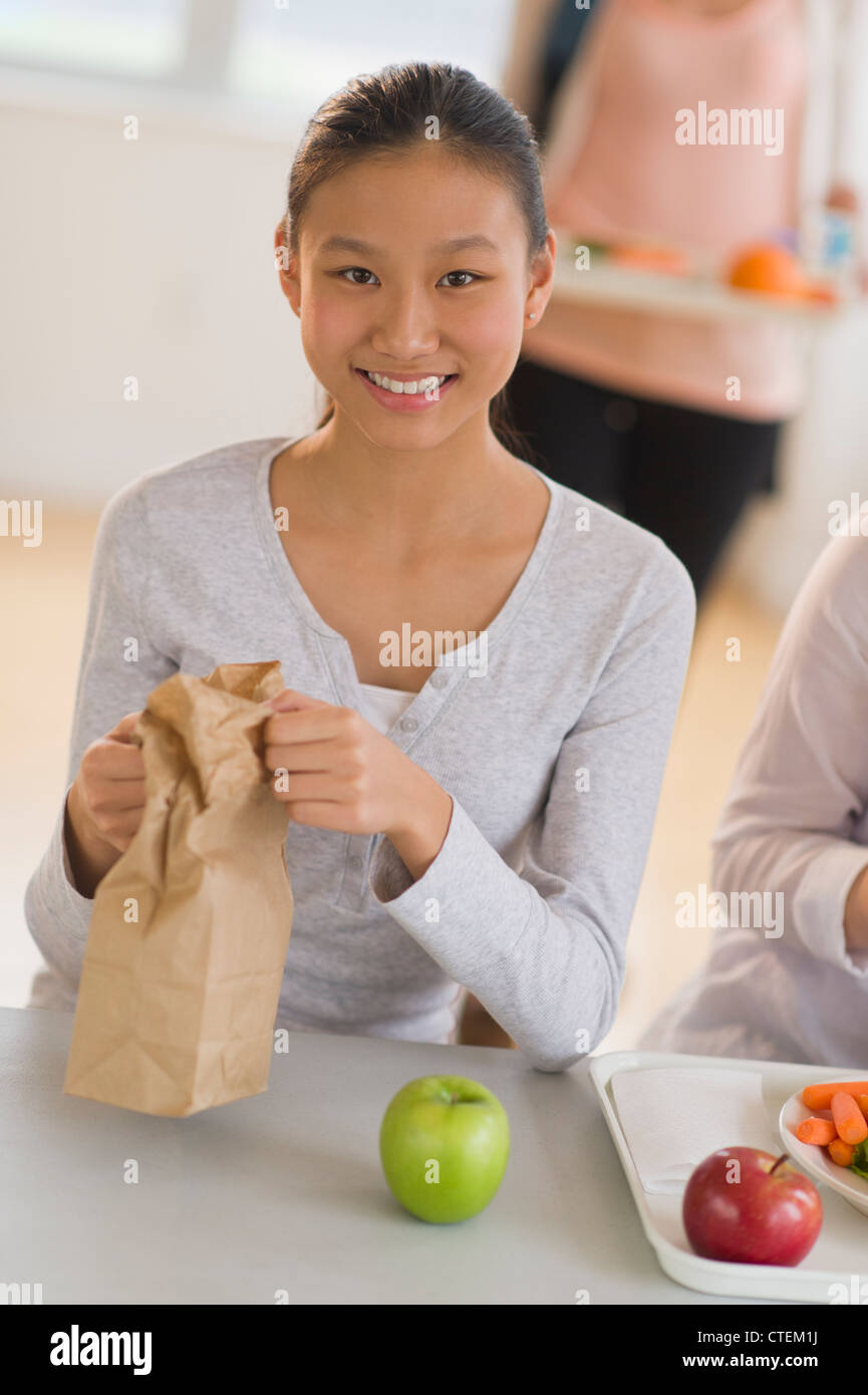 USA, New Jersey, Jersey City, Female student (14-15) having lunch Stock Photo