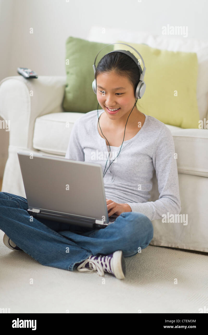USA, New Jersey, Jersey City, Girl (14-15) using laptop at home Stock Photo