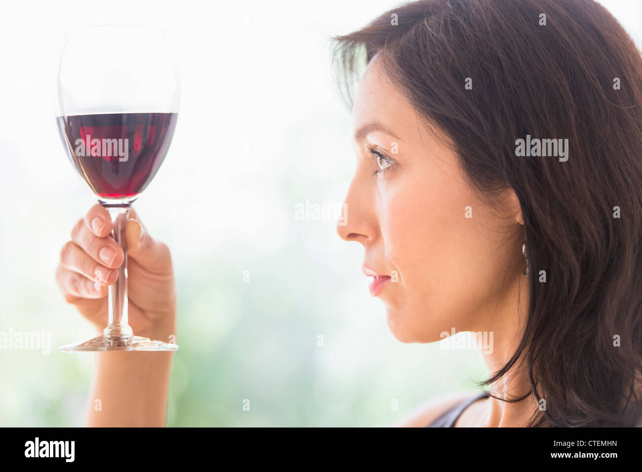 USA, New Jersey, Jersey City, Woman tasting red wine Stock Photo
