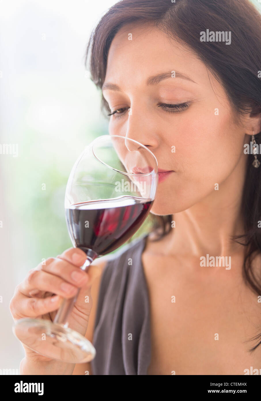 USA, New Jersey, Jersey City, Woman tasting red wine Stock Photo