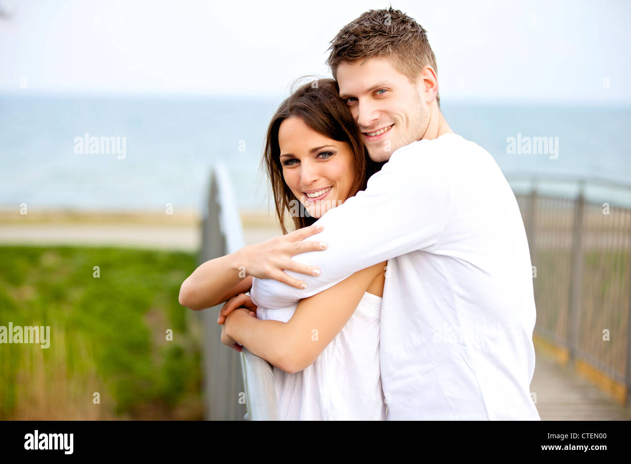 Portrait of a romantic couple hugging in the park Stock Photo - Alamy