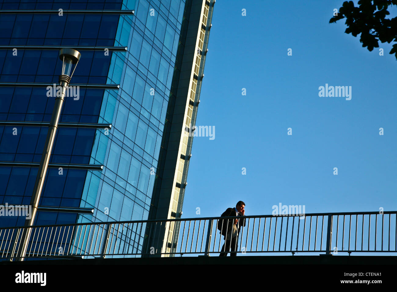 Lex building in Brussels, man passing by the EU building Stock Photo