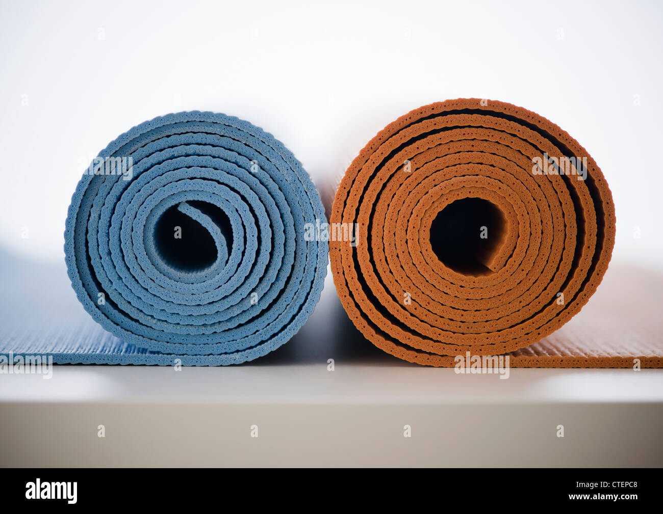 Rolled-up yoga mats Stock Photo