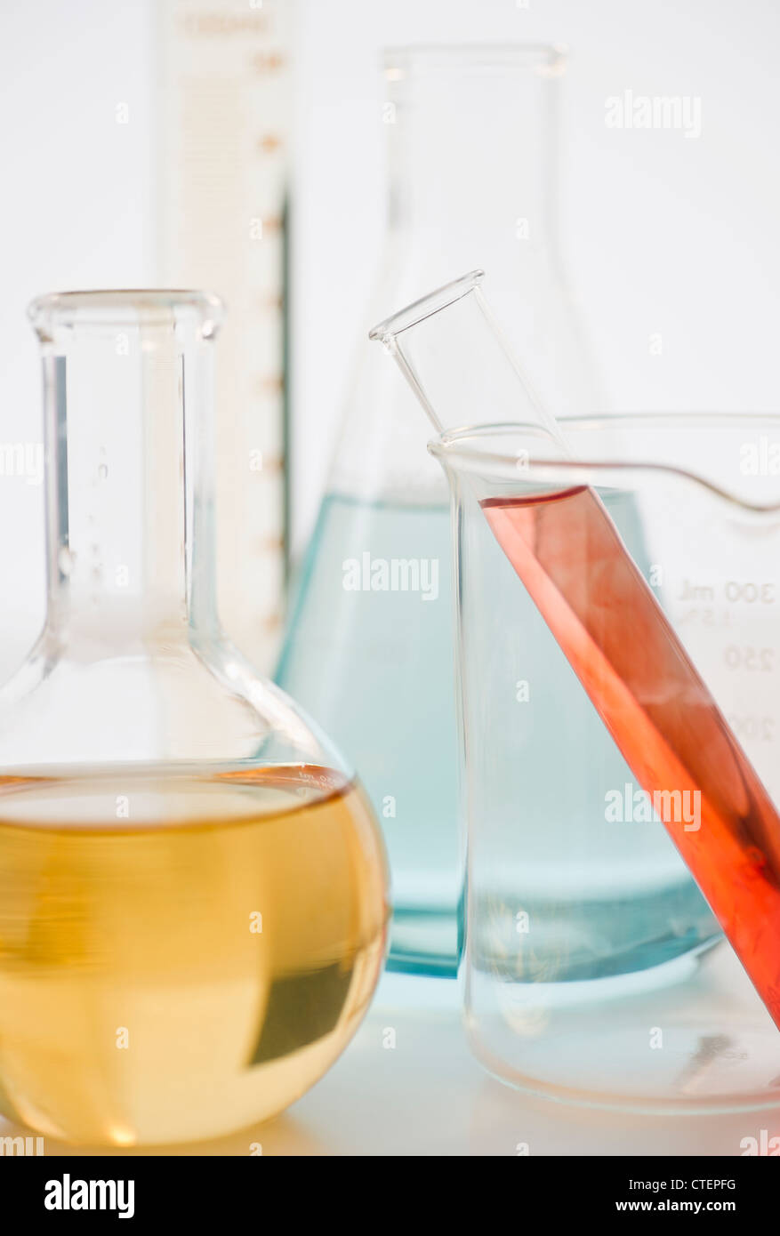 Laboratory glassware with liquids Stock Photo - Alamy