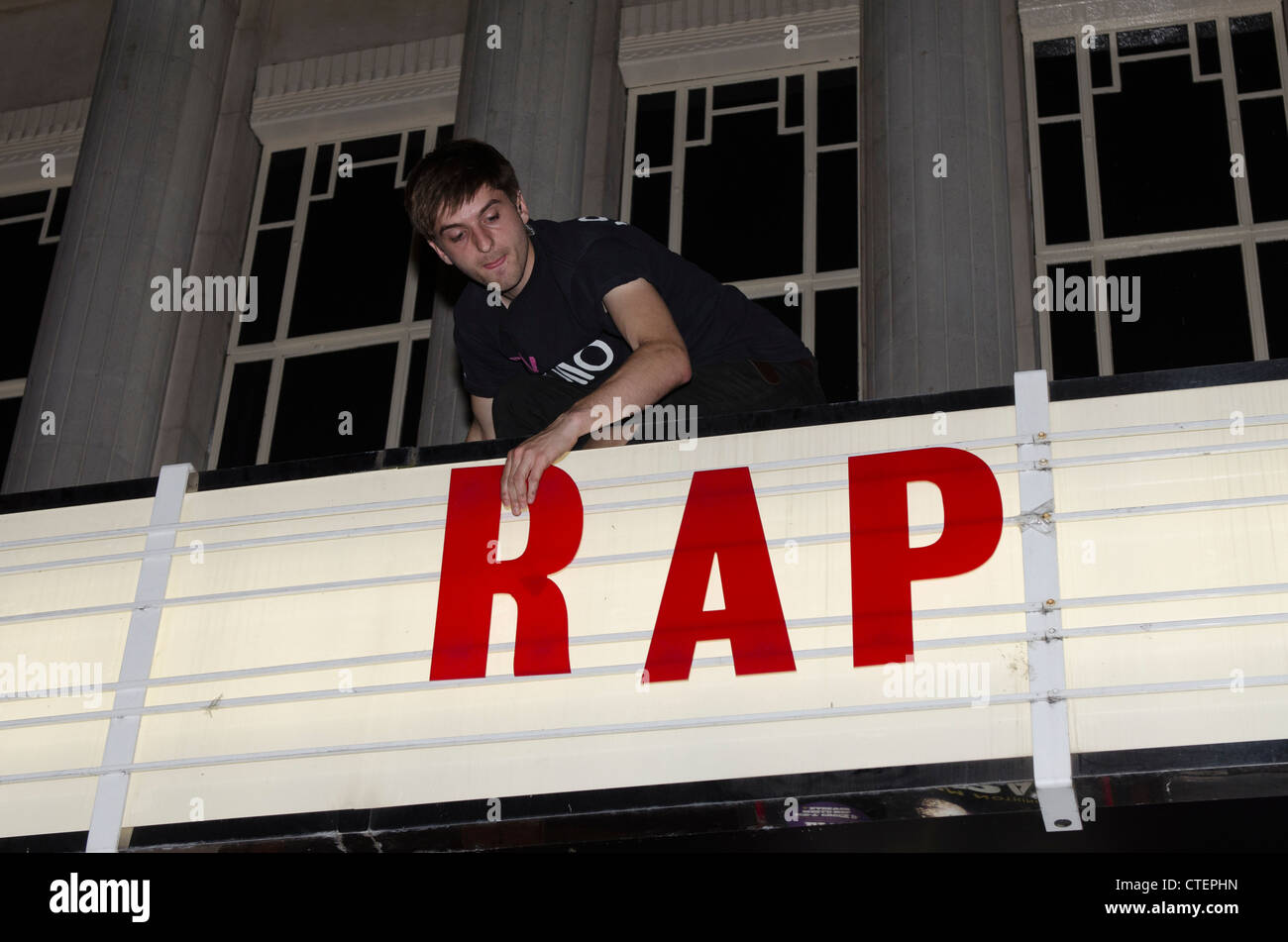 'Its a Rap', film cinema staff remove sign for The Art of Rap film premiere Hammersmith Apollo, London  Uk Stock Photo