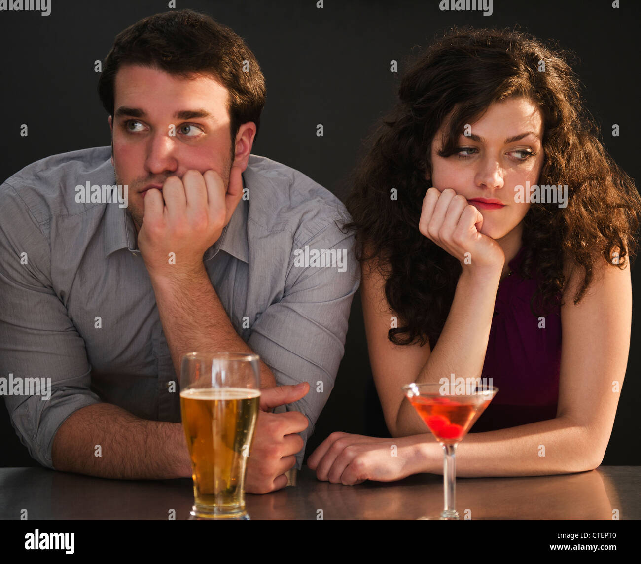 USA, New Jersey, Jersey City, Bored couple sitting at bar counter Stock ...