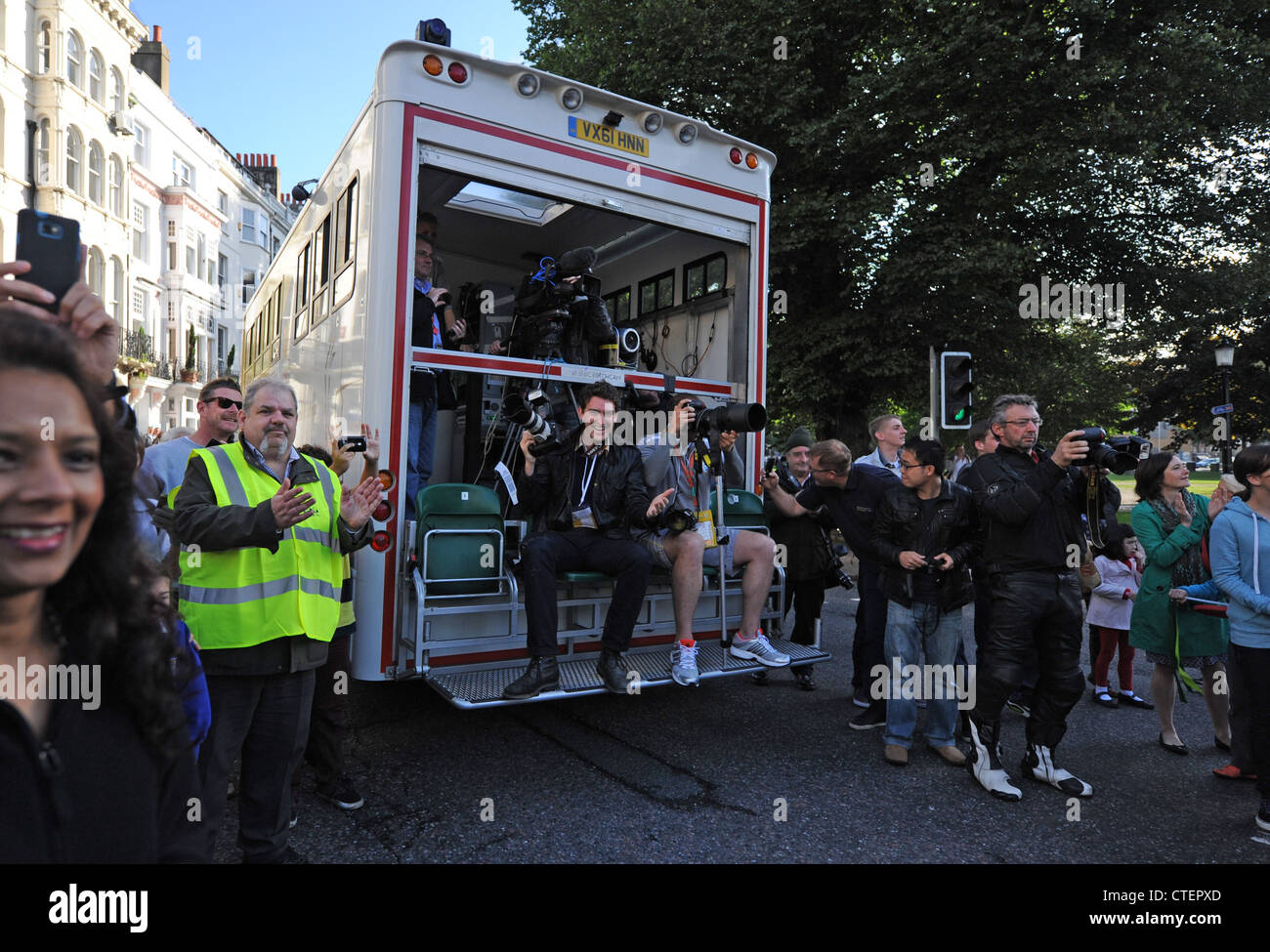 Photographers and media on the official LOCOG Bus at the Olympic Torch relay event in Brighton 17 July 2012 Stock Photo