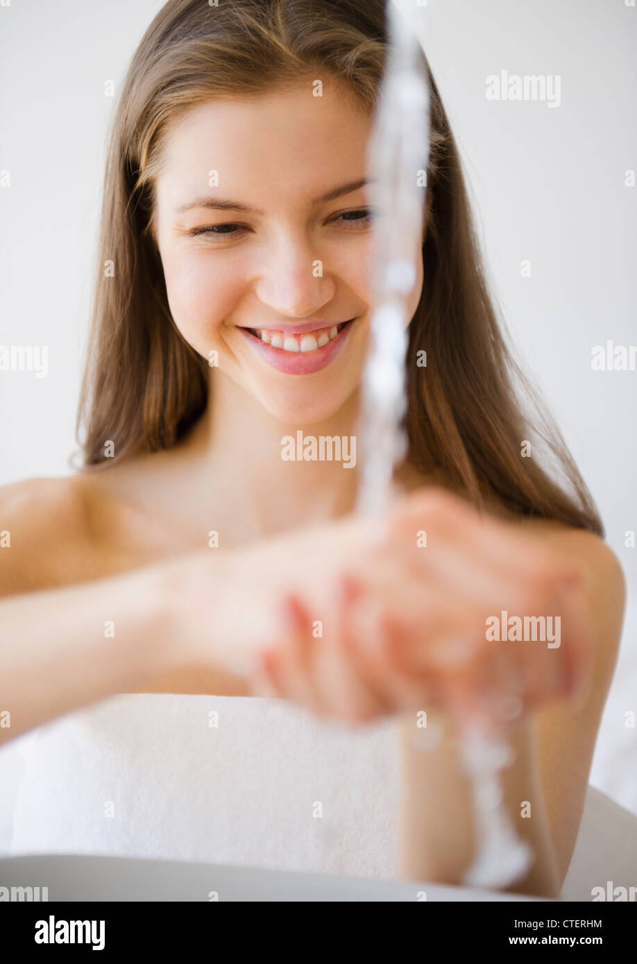 Woman washing hands Stock Photo