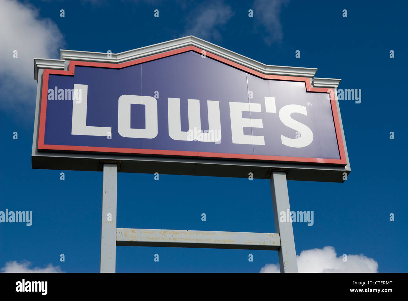 Lowe’s Home Improvement store sign against a clear blue sky, symbolizing home renovation and DIY retail, USA. Stock Photo