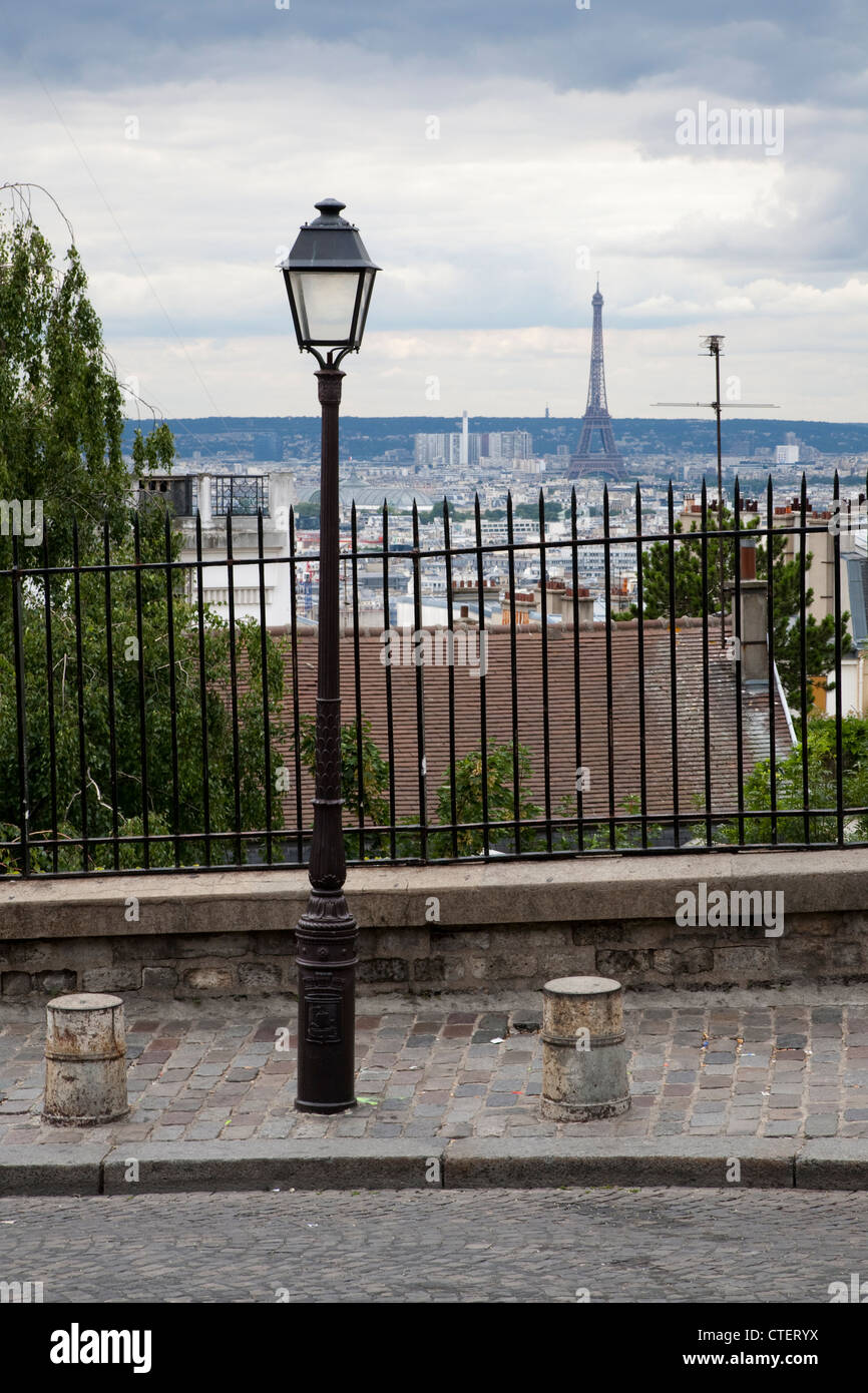View towards Eiffel Tower from street in Montmartre, Paris Stock Photo