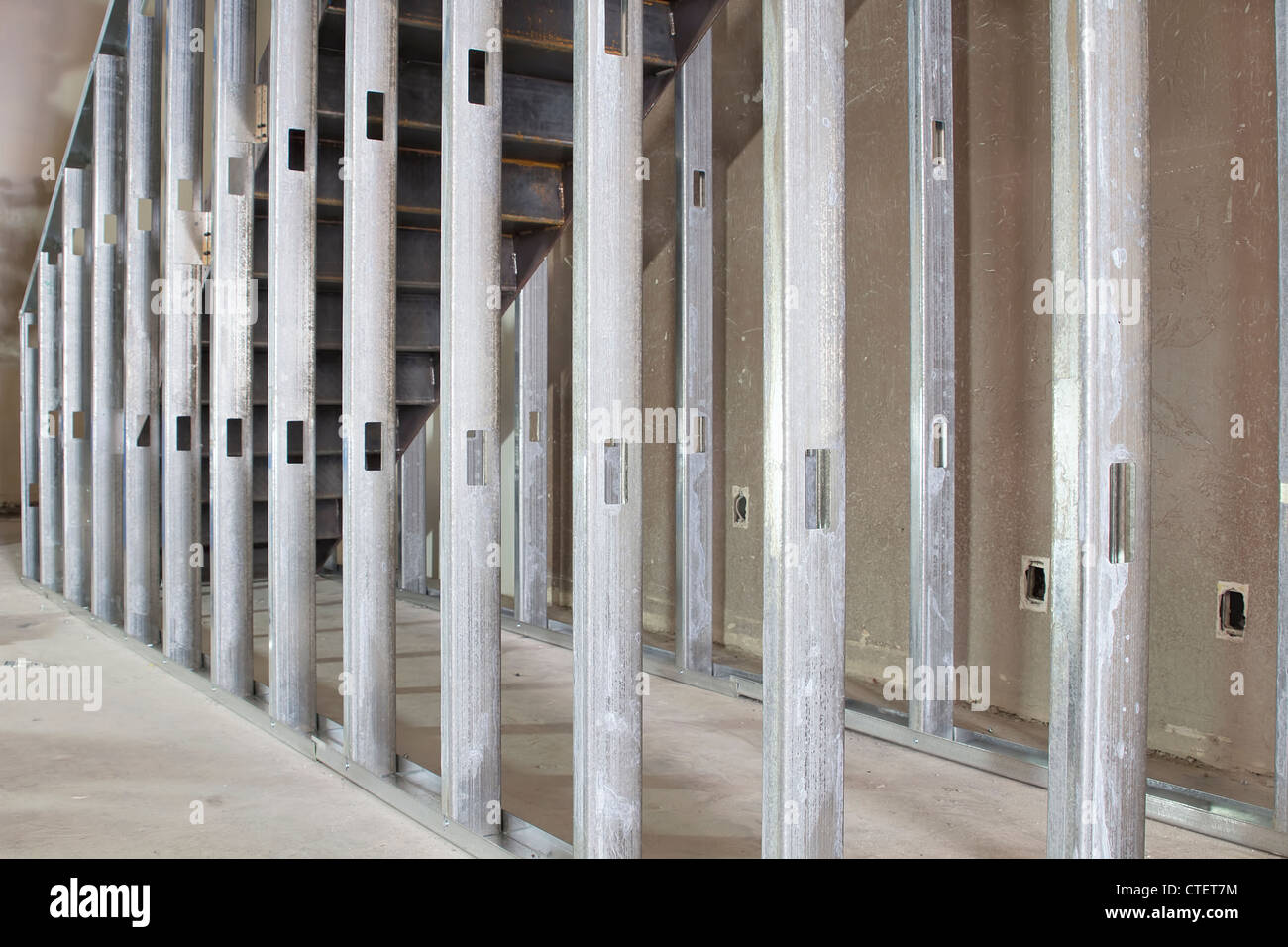 Metal Stud Framing Under the Steel Staircase in Commercial Space Stock Photo