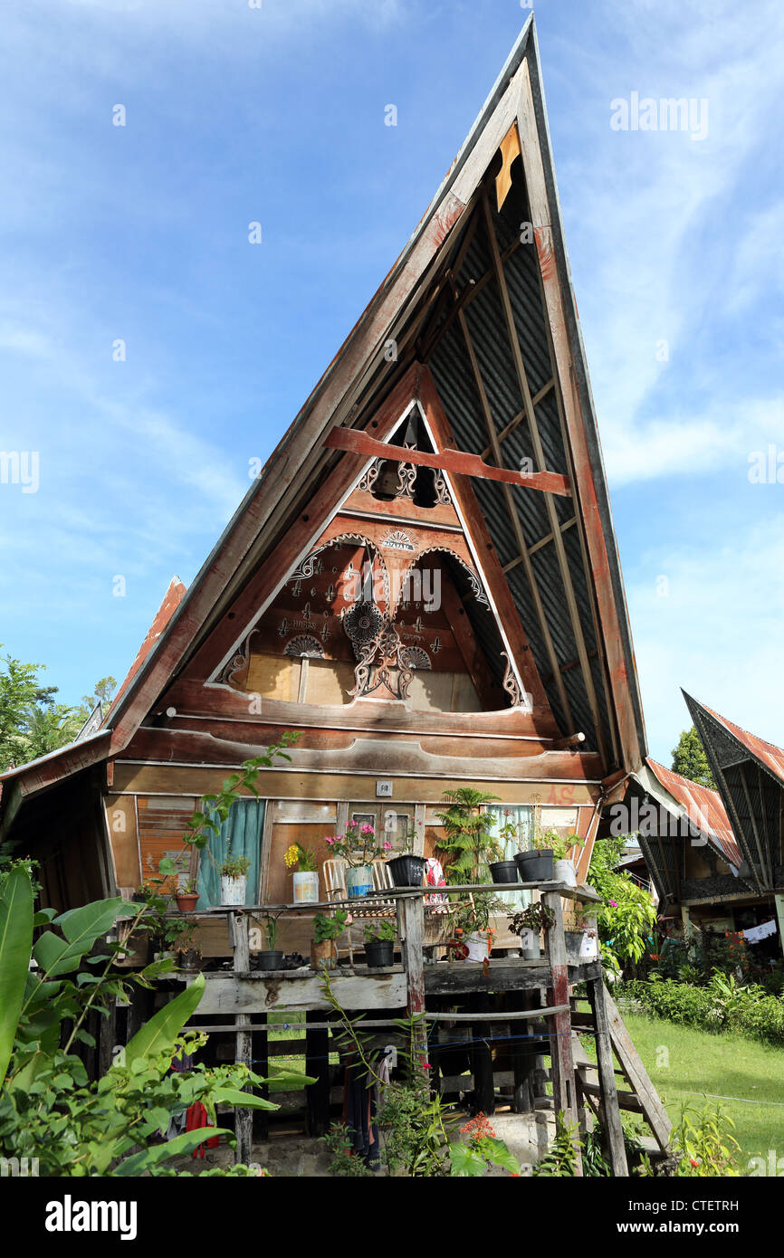 Traditional Batak house on Samosir Island, Lake Toba, North Sumatra. Stock Photo