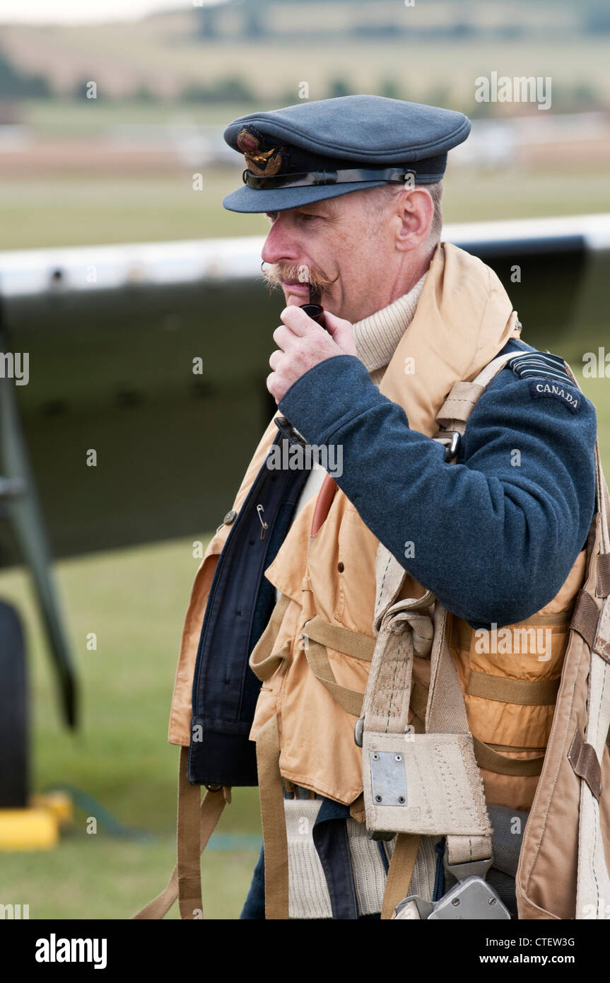 Pilot in period flying gear, with handlebar moustache and pipe, at the Flying Legends Airshow, Imperial War Museum, Duxford Stock Photo