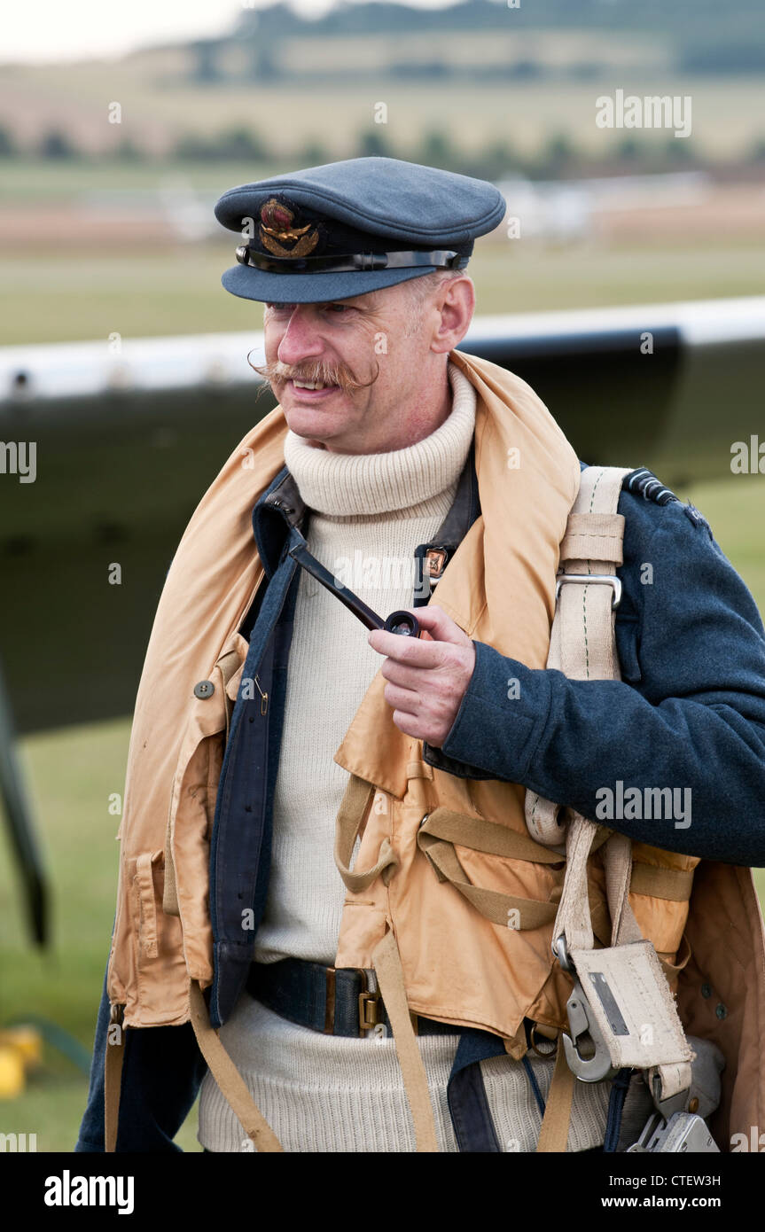 Pilot in period flying gear, with handlebar moustache and pipe, at the Flying Legends Airshow, Imperial War Museum, Duxford Stock Photo