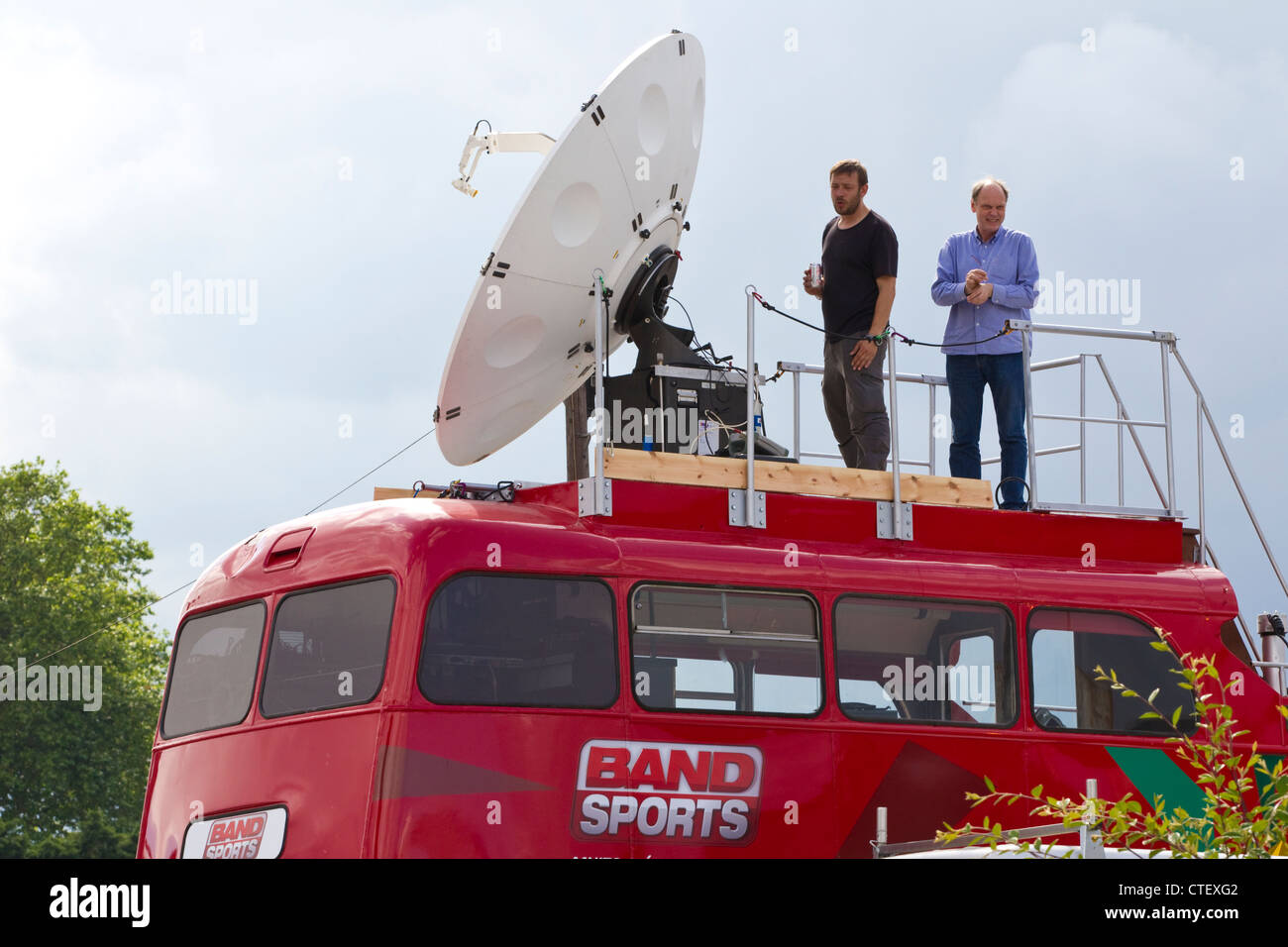 Television technicians aboard a television network satellite bus during