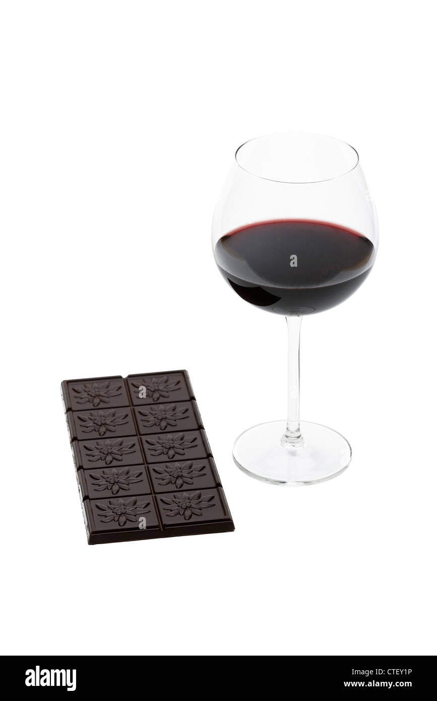 Dark chocolate bar and glass of red wine two pleasurable foods with healthy antioxidant benefits Stock Photo