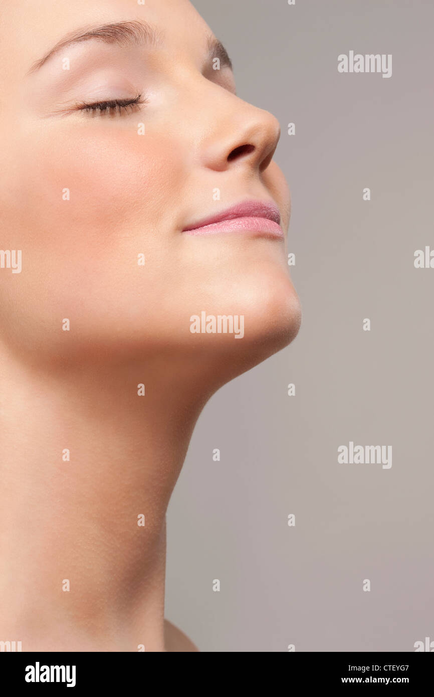 Portrait of young woman with eyes closed Stock Photo - Alamy