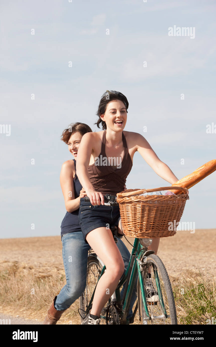 France, Picardie, Albert, Young women on bikes on country road Stock Photo  - Alamy