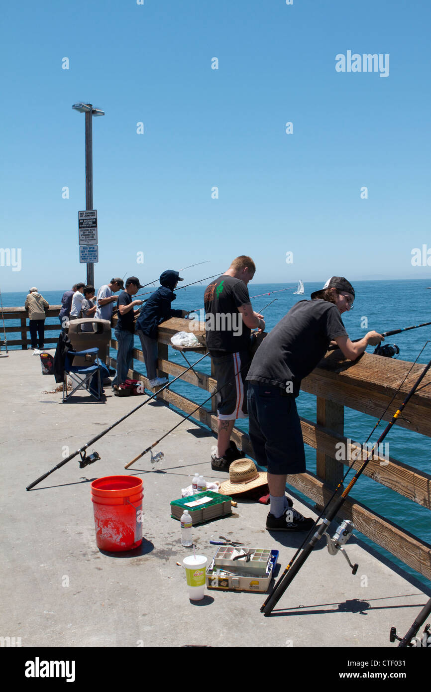 Fishing on newport beach pier hi-res stock photography and images