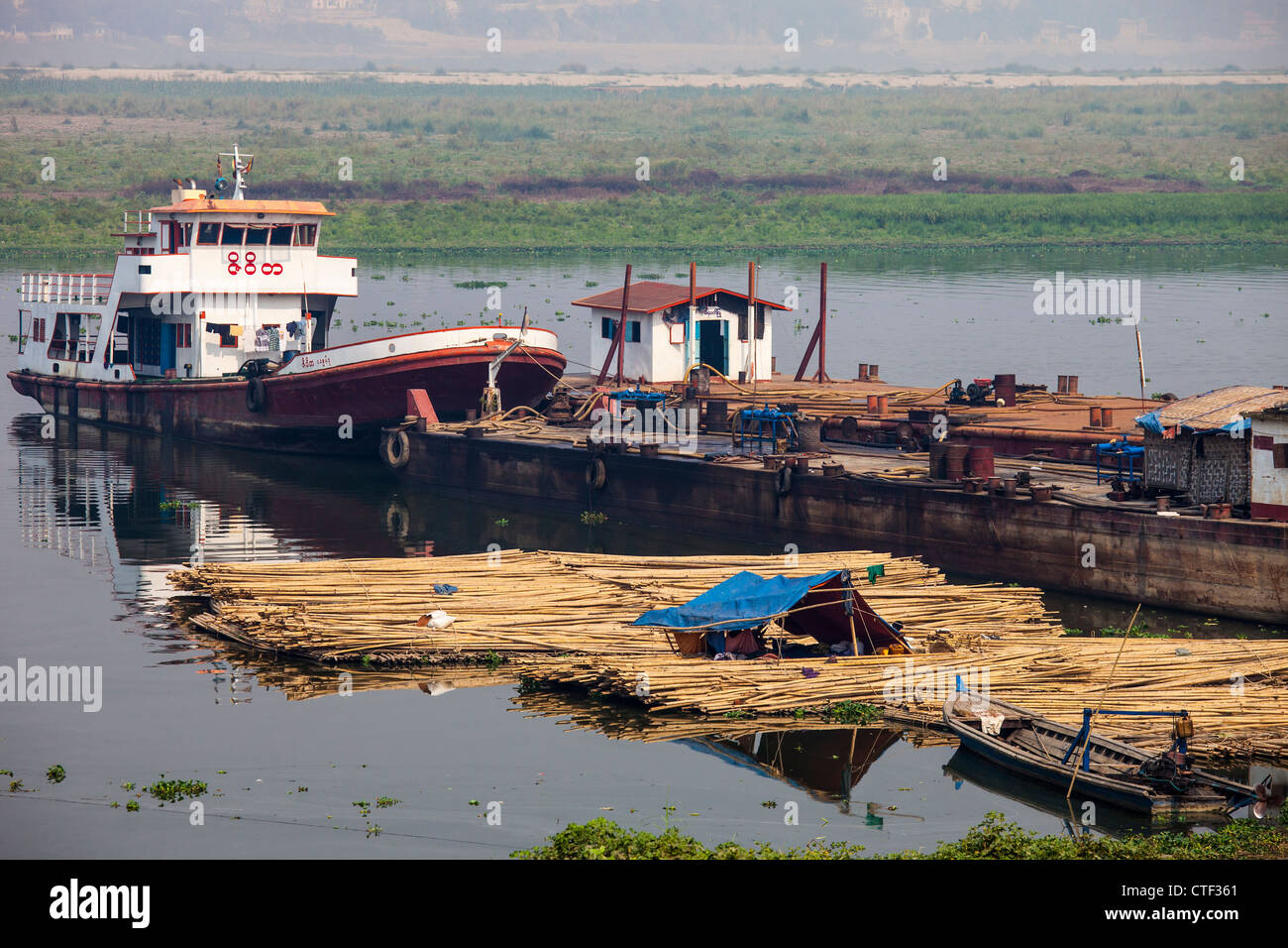 Transporting logs on the Irrawaddy River near Mandalay, Myanmar Stock Photo