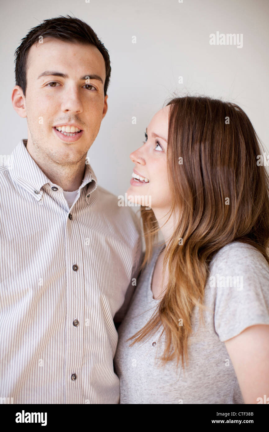Portrait of happy young couple Stock Photo - Alamy