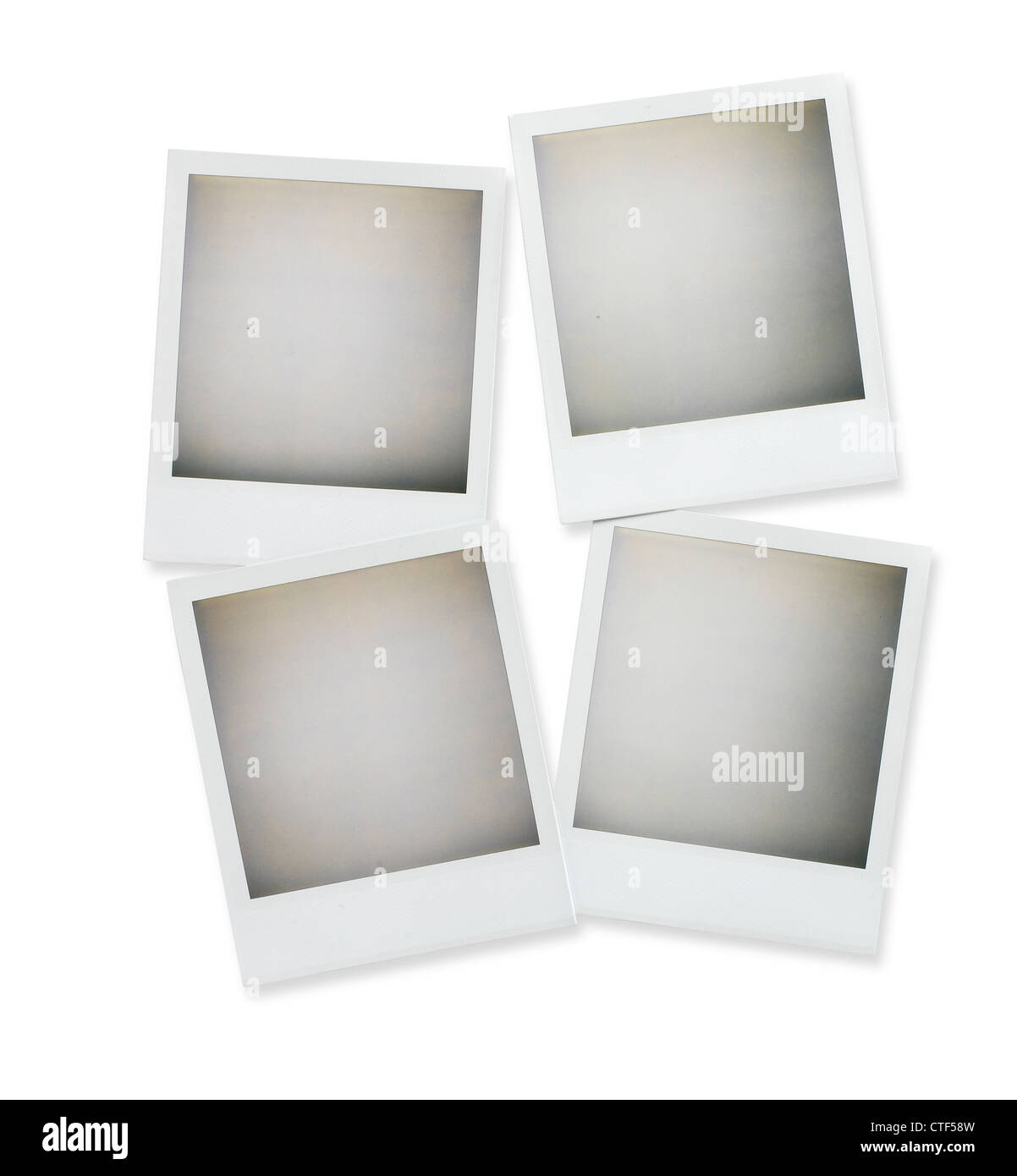 four blank polaroid pictures overhead isolated on white with clipping path Stock Photo