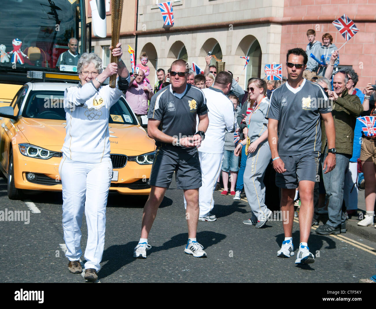 The Olympic Flame past through the historic town of Berwick upon Tweed on the 14th of June 2012 Stock Photo