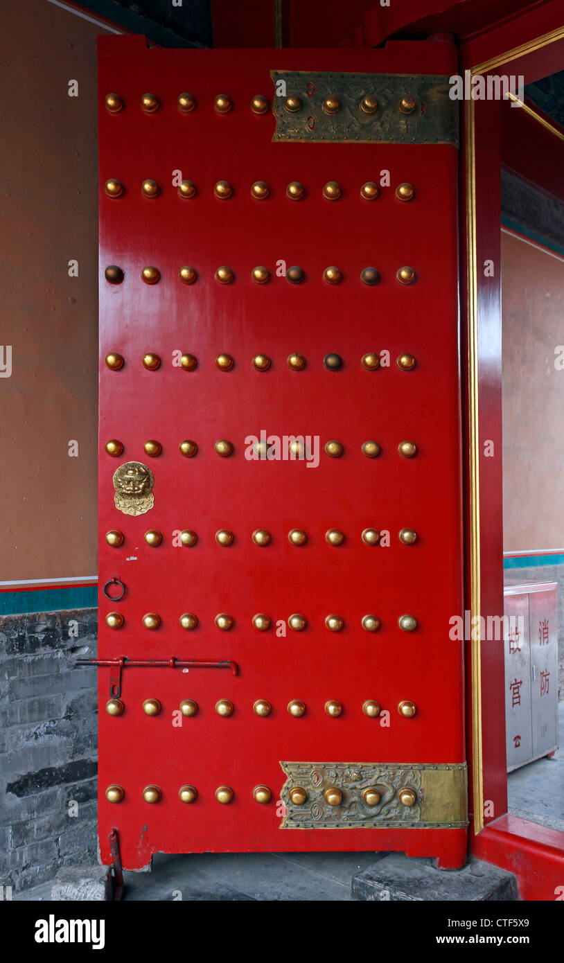 the Forbidden City, Beijing, China. Door showing the lucky number of studs on it 9 x 9 81 Stock Photo