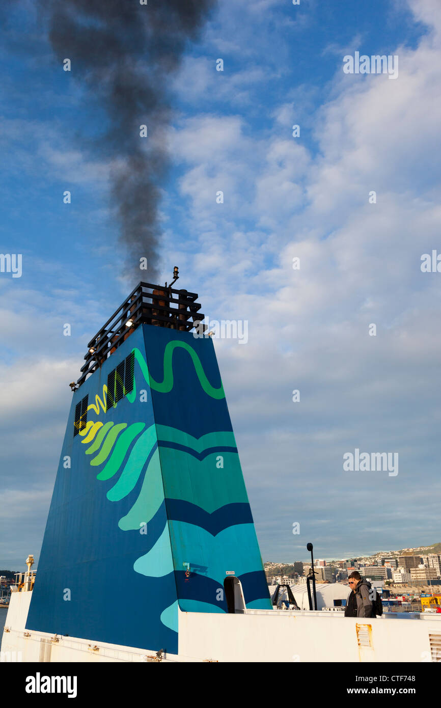New Zealand inter-island ferry emitting smoke during embarkation Stock Photo