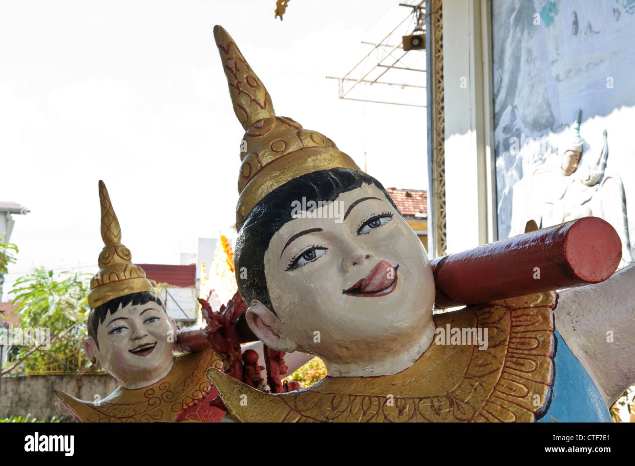 Laughing bell bearers, Dhammikarama Burmese Temple, Georgetown, Penang, Malaysia. Stock Photo