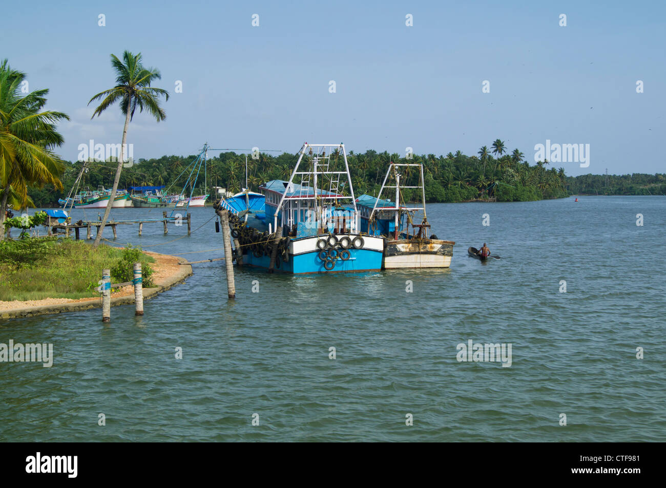 Fishing Boats on backwaters of alapuzha, Kerala Stock Photo