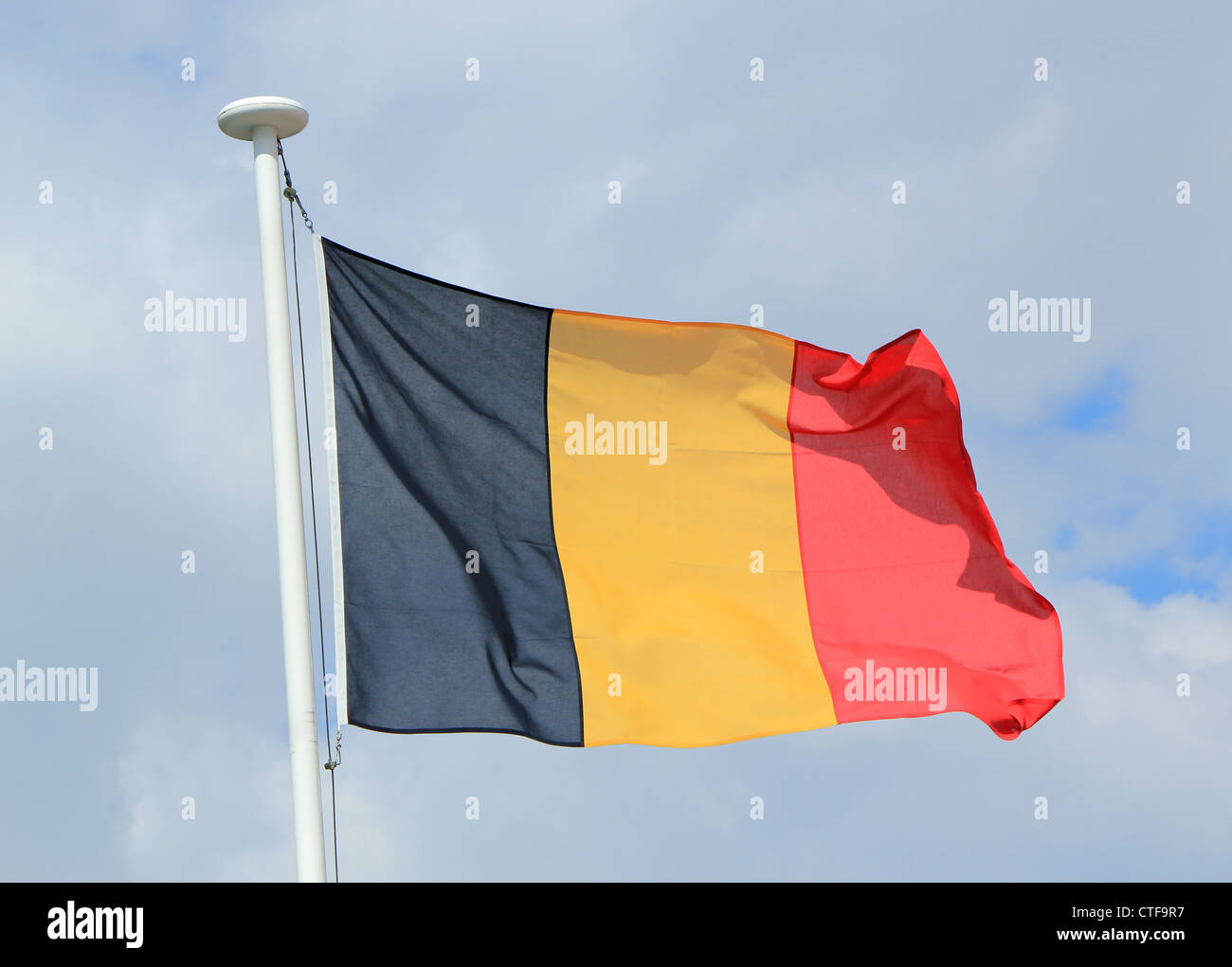 Flag of Belgium against cloudy sky Stock Photo