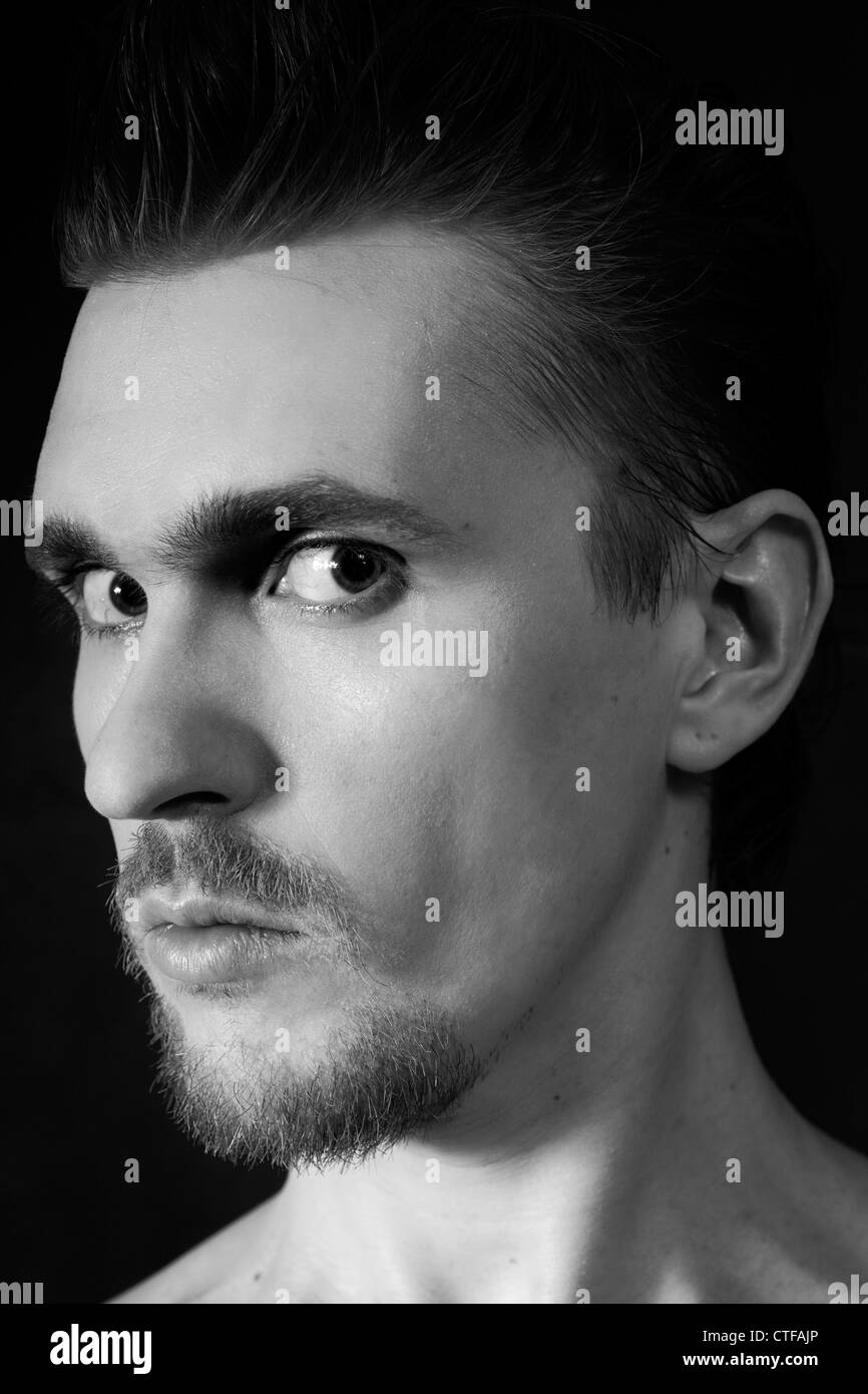 Black and white portrait of young trendy guy in the studio Stock Photo ...