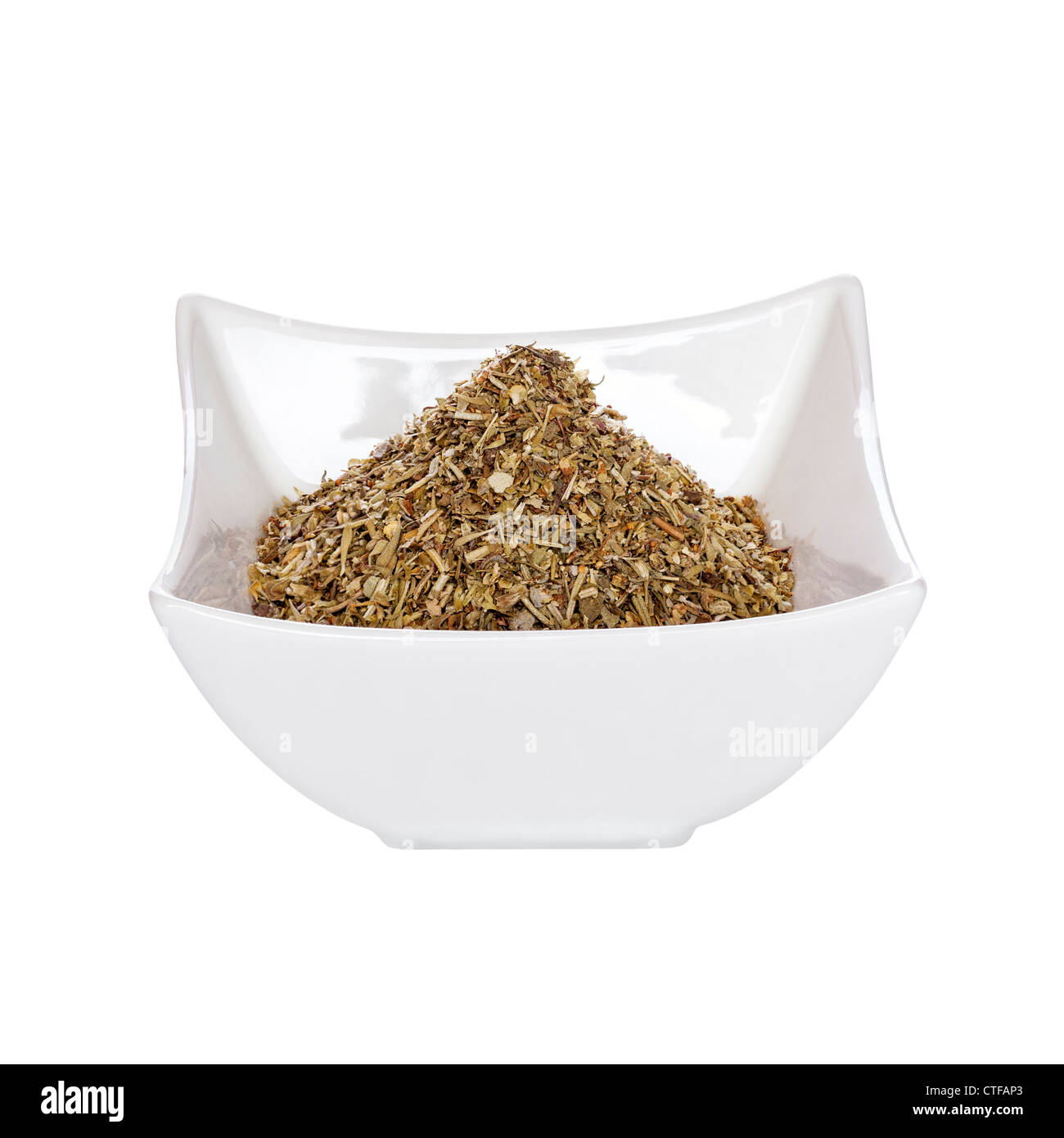 A small pot of dried mixed herbs, isolated on white. Fully in focus, front to back. Stock Photo