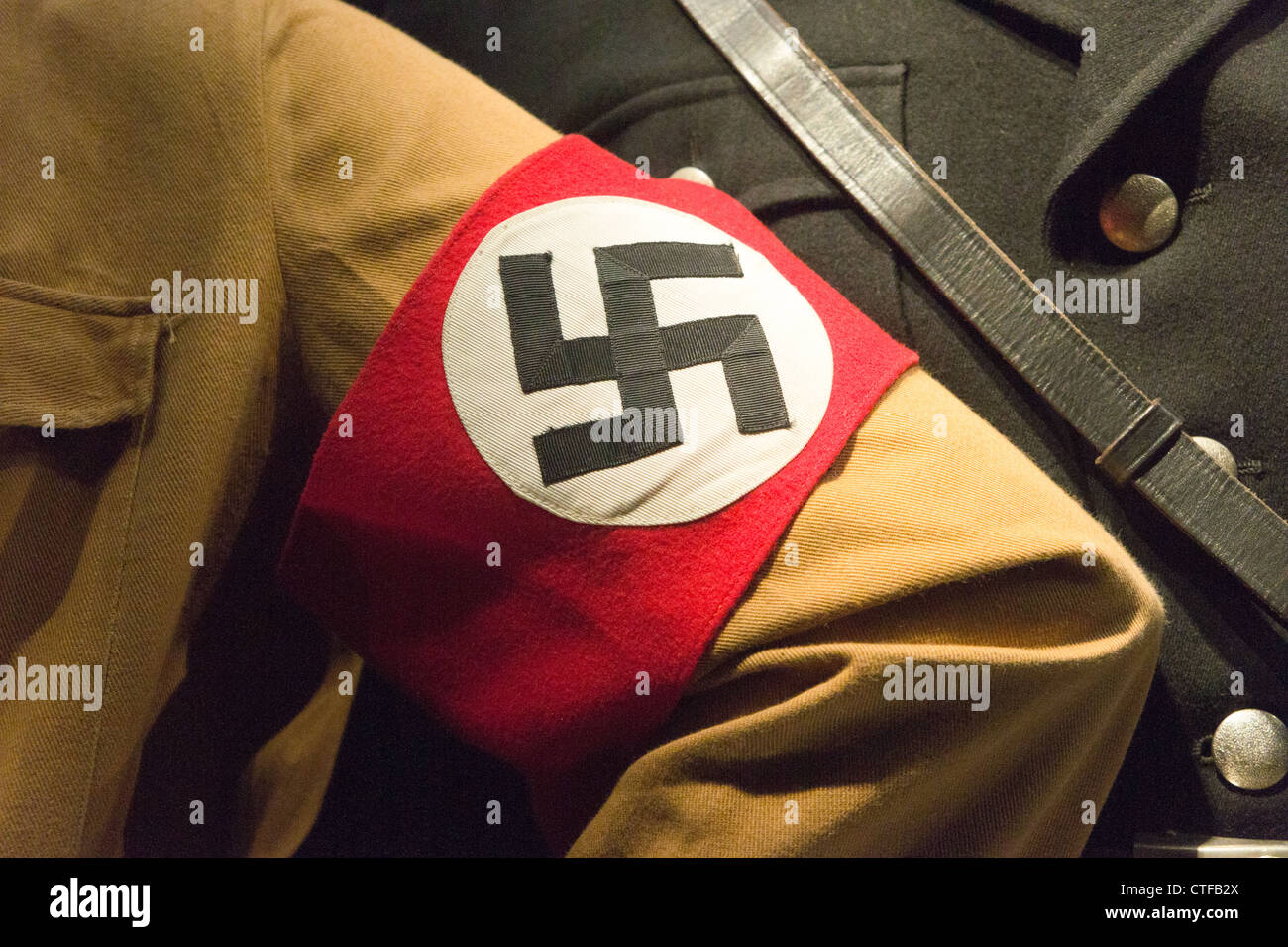 Nazi swastika armband on brownshirt uniform. Stock Photo