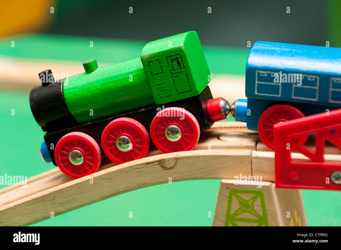 Toy train crossing bridge. Stock Photo