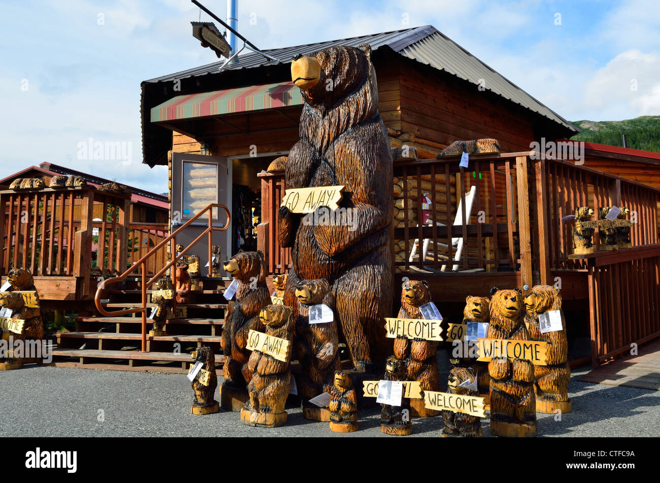 Wood carved bears holding signs. Alaska, USA Stock Photo Alamy