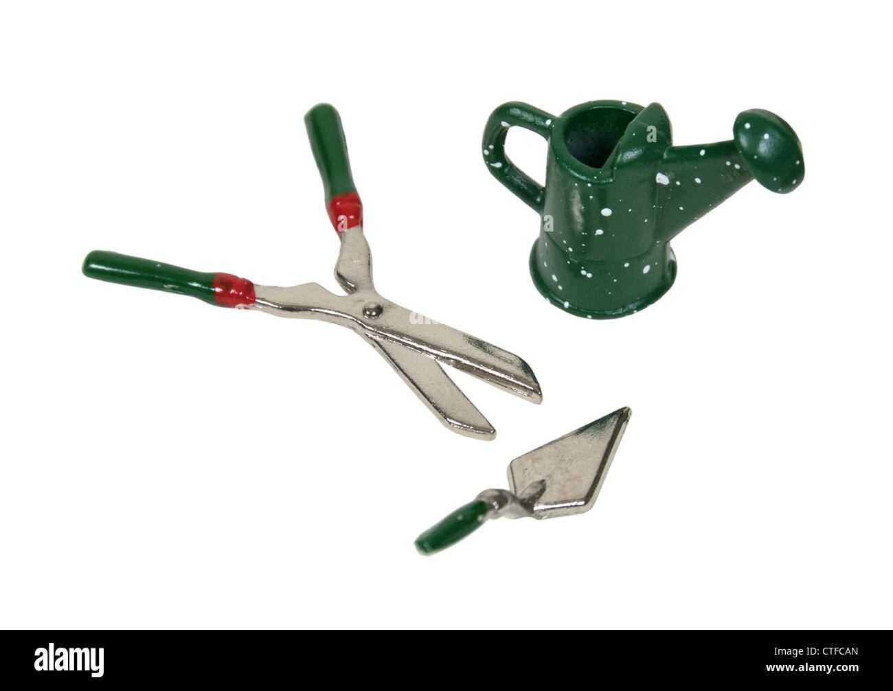 Watering can and clippers and trowel for working in the garden - path included Stock Photo