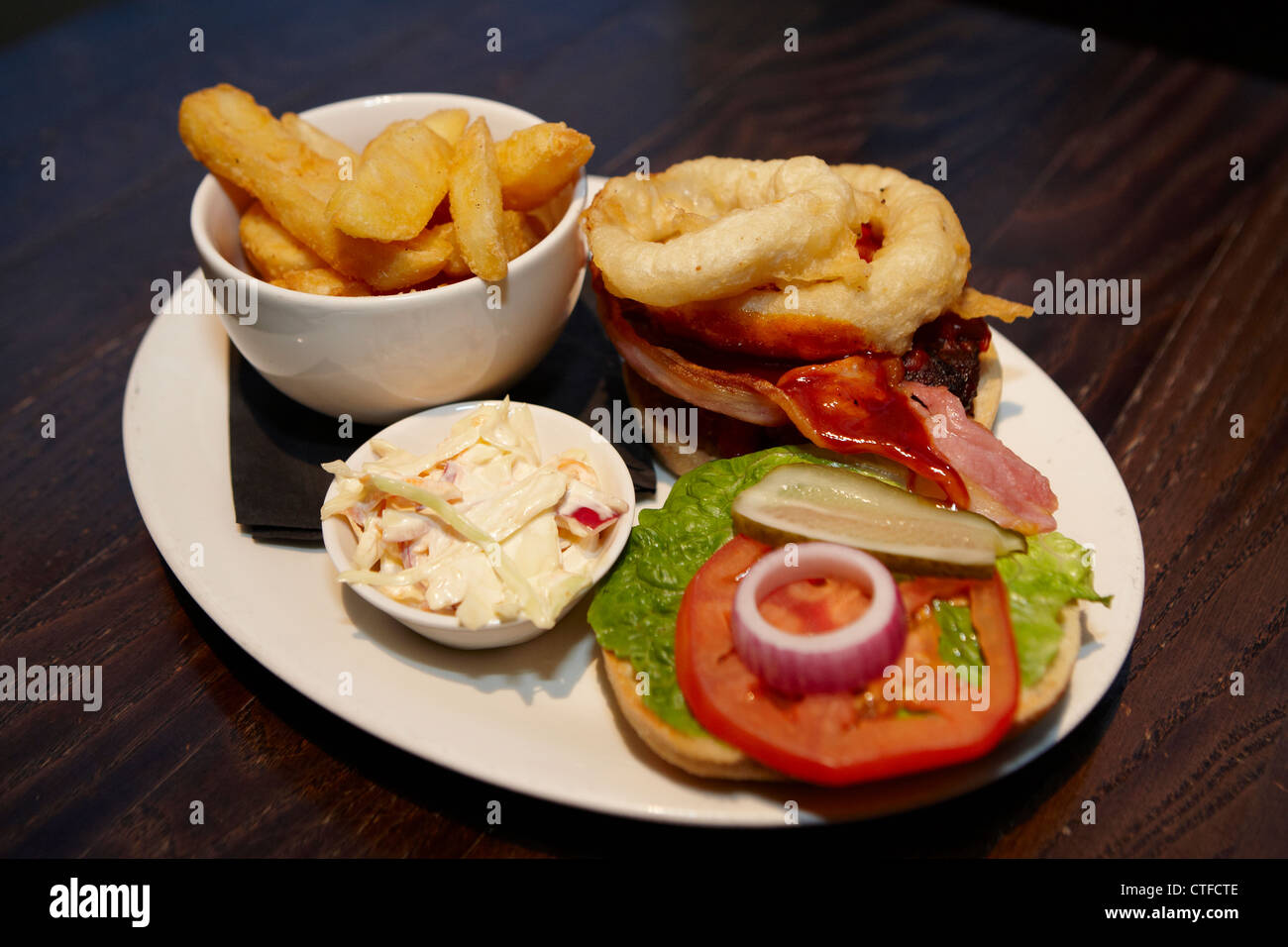 Cheeseburger and chips with onion rings Stock Photo