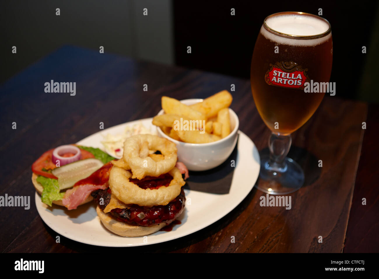 Cheeseburger and chips with onion rings Stock Photo