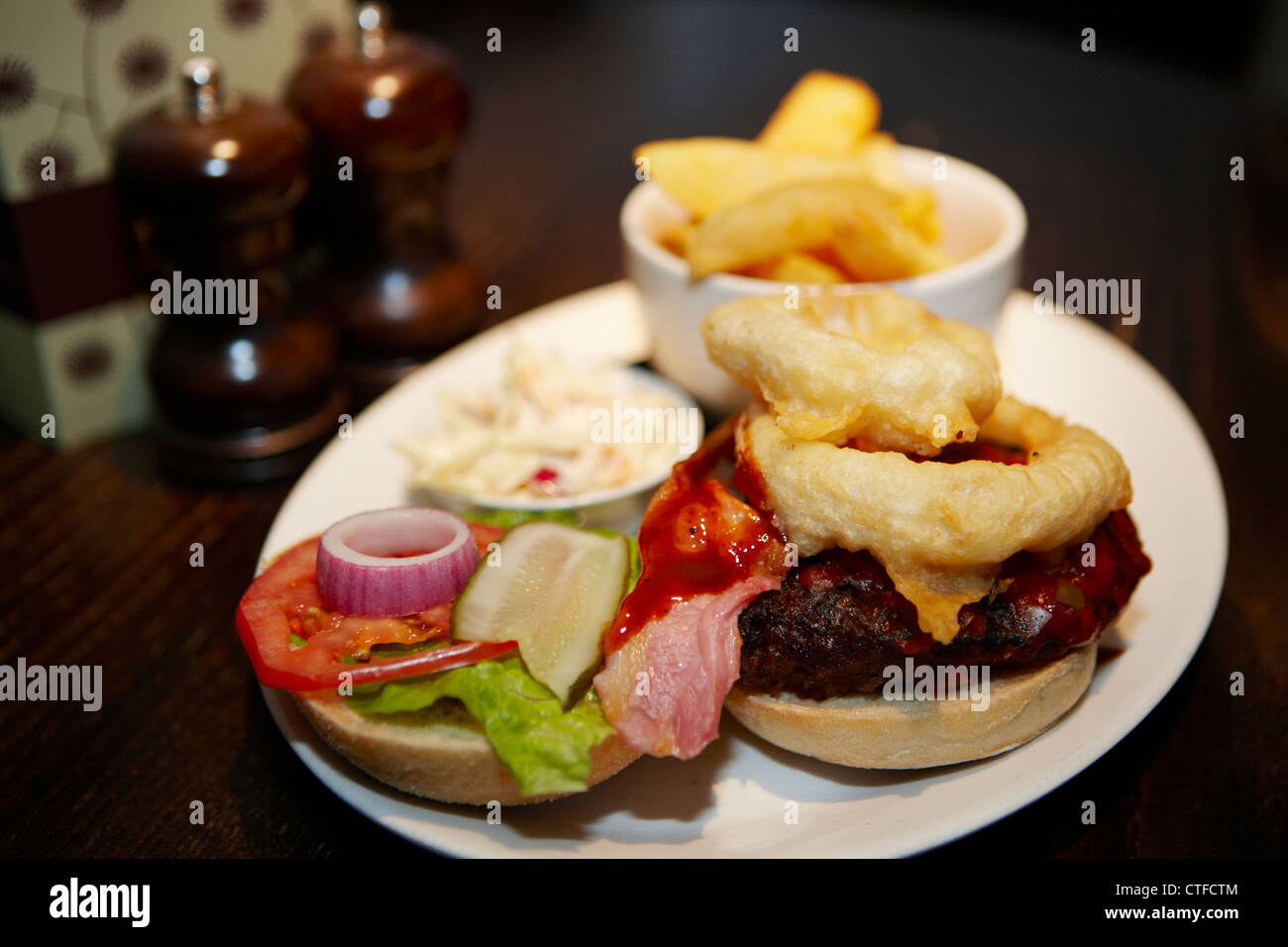 Cheeseburger and chips with onion rings Stock Photo