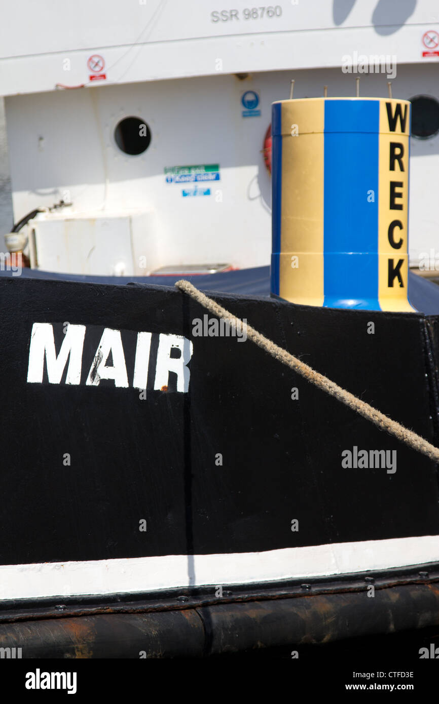 The deep sea vessel Mair with wreck buoy aboard, Swansea harbour Stock Photo