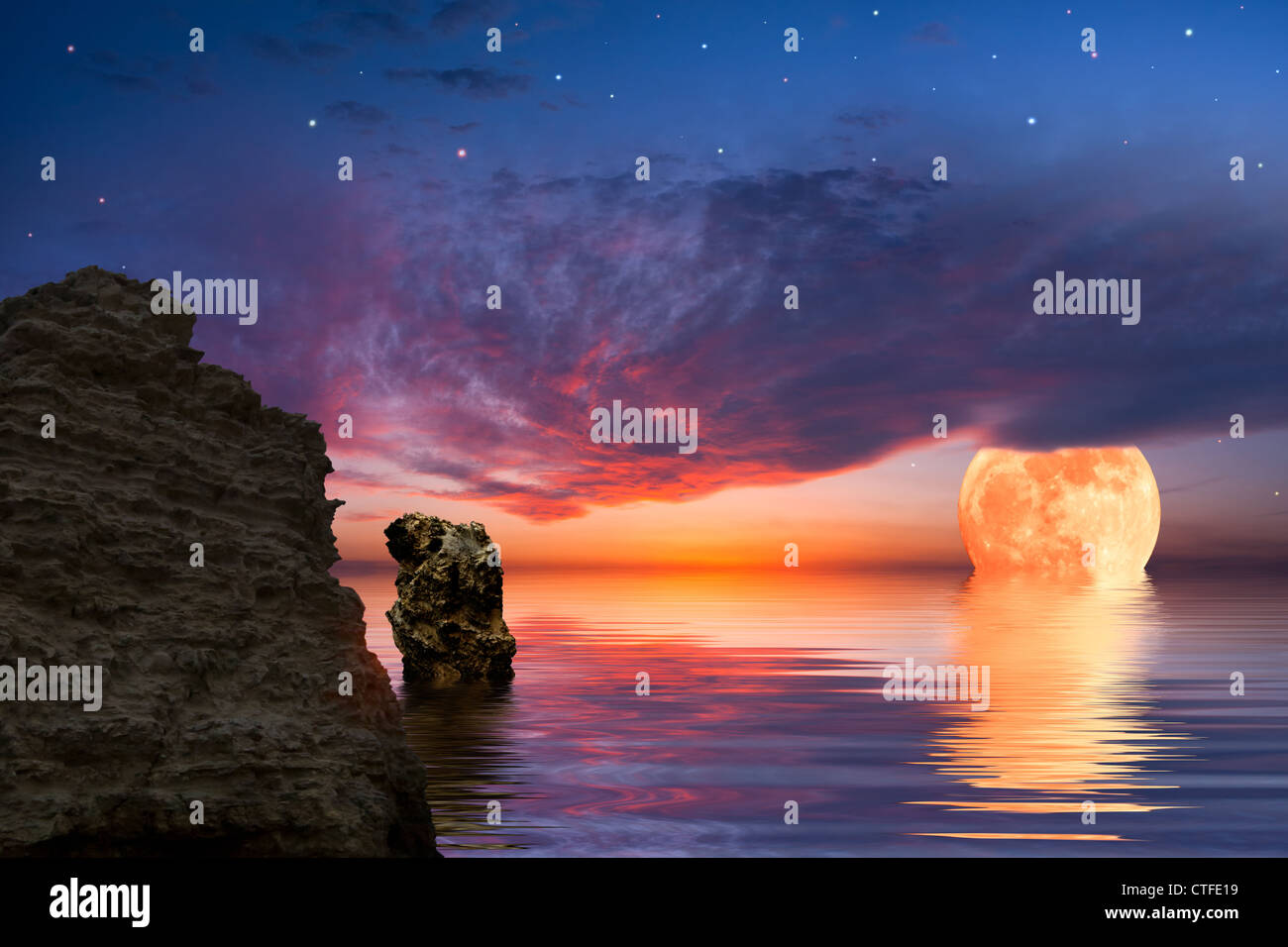 Colorful landscape with big moon and rock at the ocean, sky reflected in water Stock Photo