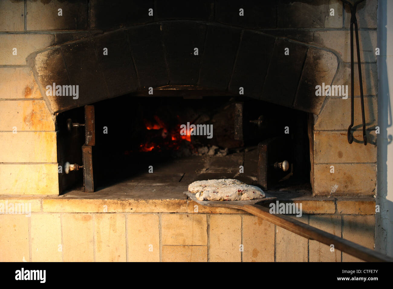 Bread baking in a stone oven Stock Photo Alamy