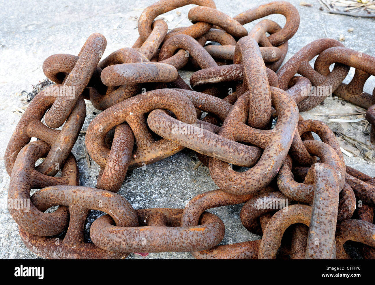 A pile of rusted chains at a typical fishing port in Okinawa, Japan Stock Photo