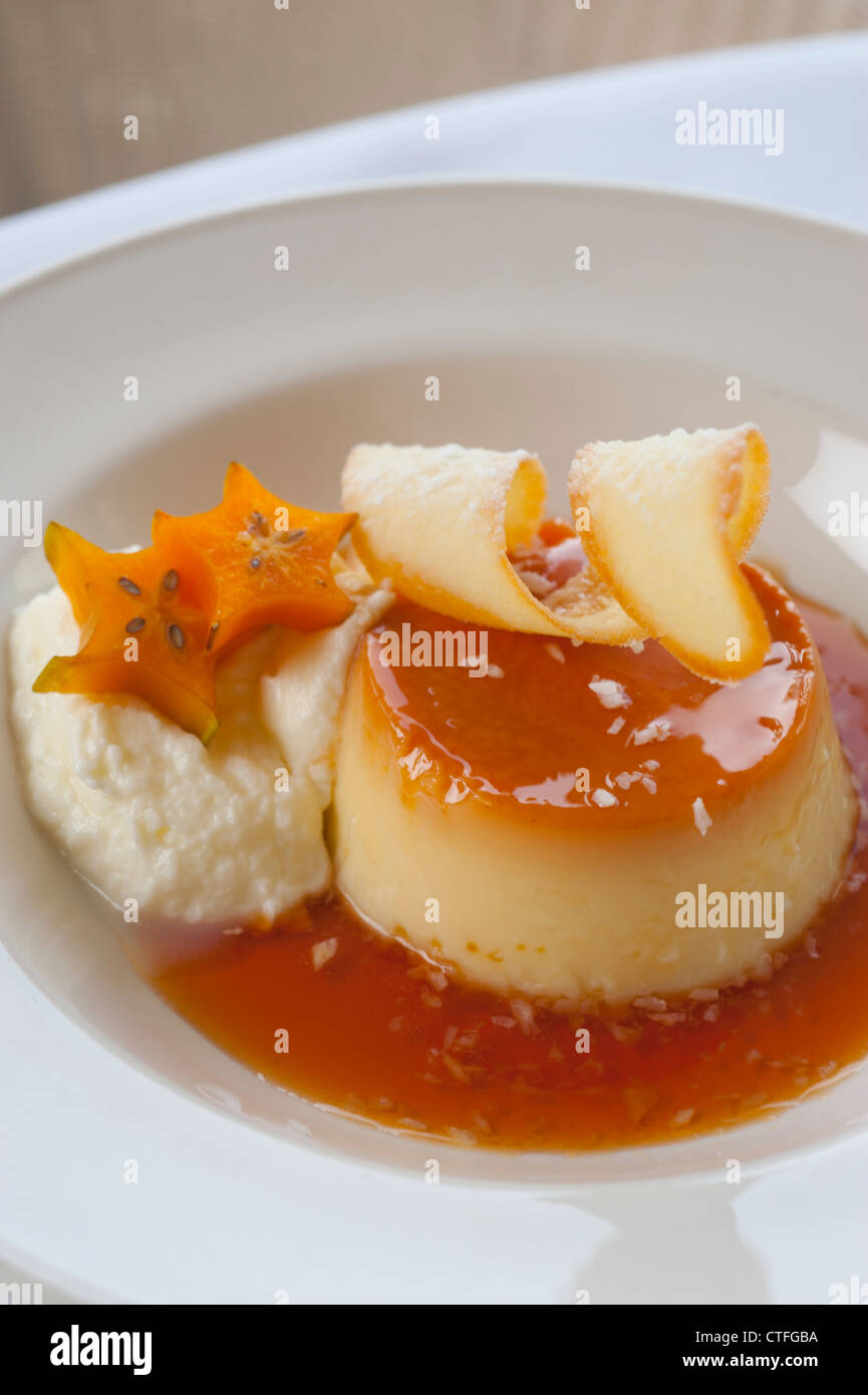 Food Dessert Flan with star fruit fine dining restaurant sweets Stock