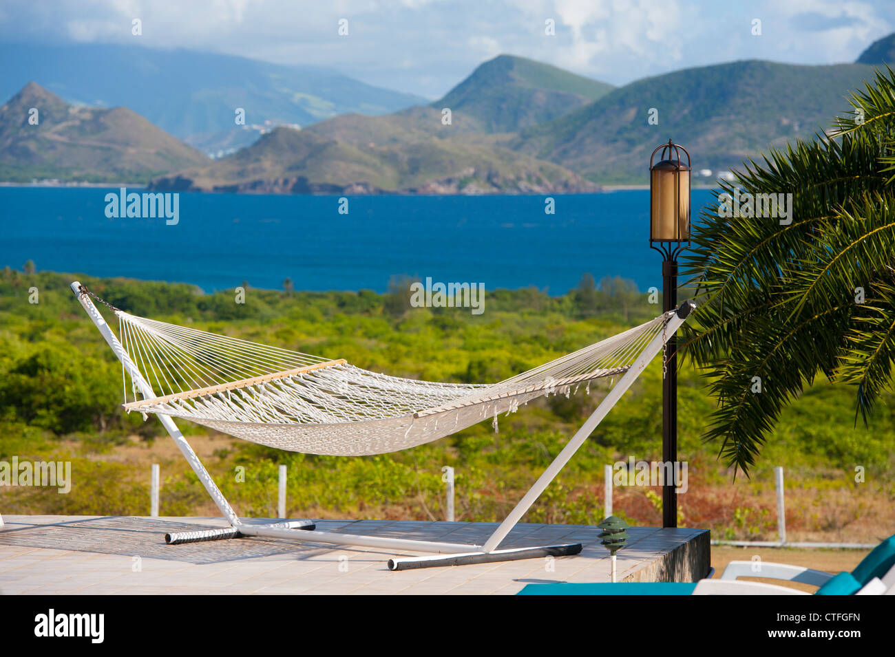 Caribbean West Indies Nevis Mount Nevis Hotel - Hammock by the pool with a view of St. Kitts Stock Photo