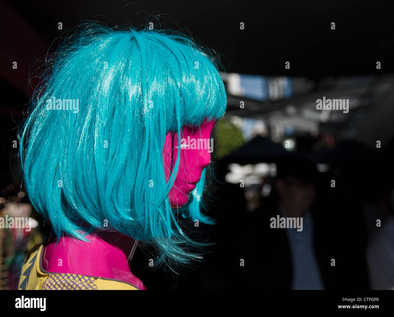 A colourful wig on a mannequin Stock Photo